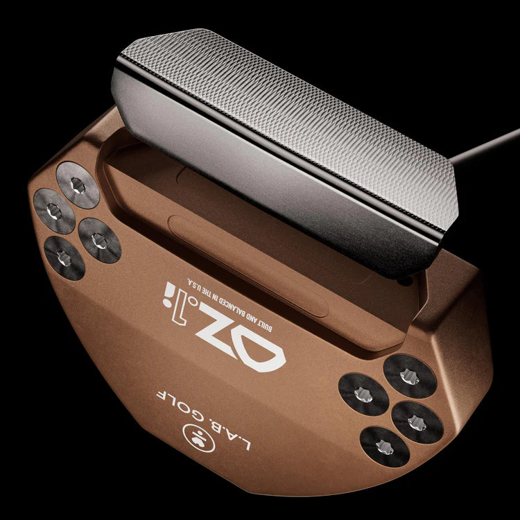 Top view of L.A.B. OZ.1i Stock putter in bronze with black grip, showcasing its design and construction.