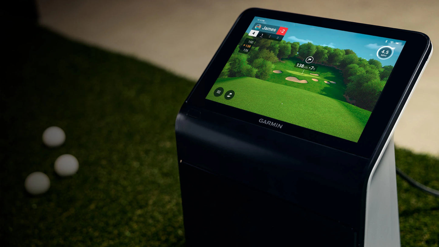 Garmin Approach R50 golf simulator with 10" touchscreen display ready for a game on a golf course.