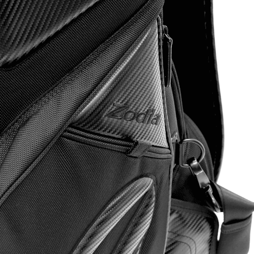 Close-up of Zodia Carbon Design Caddy Bag II showcasing durable carbon-look fabric and zippered pockets.