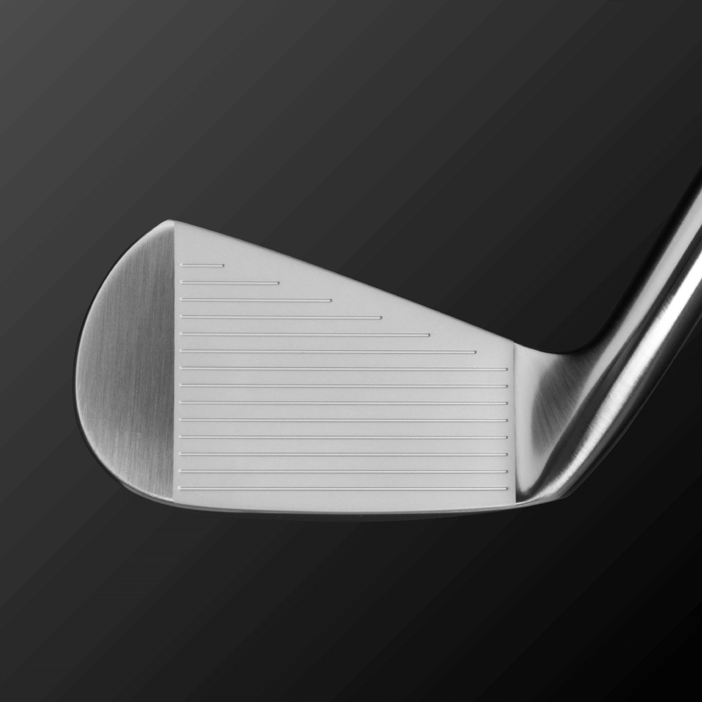 Close-up of the Zodia Z621 iron-type utility clubface showing flat design and groove pattern for optimal spin.