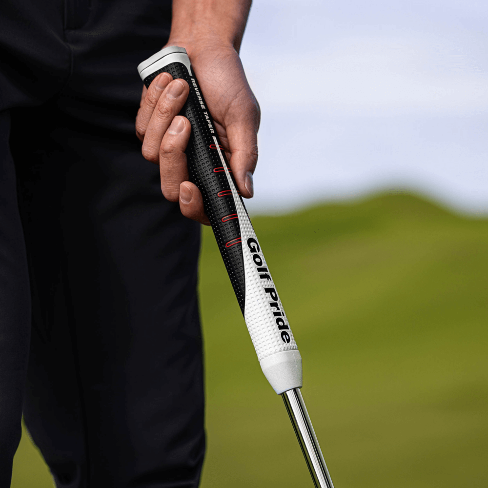 Golf Pride Reverse Taper Pistol grip held by a golfer, designed for optimal putting performance.