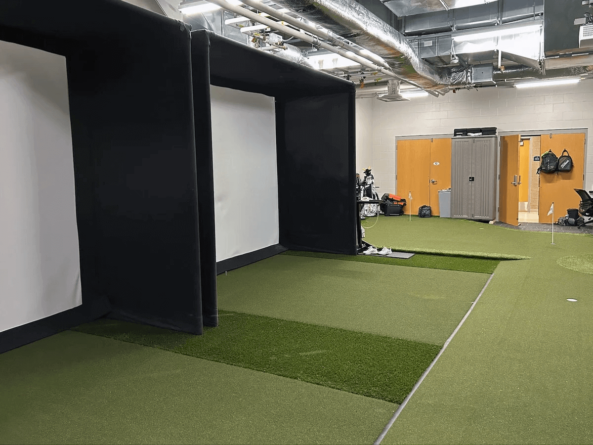 Indoor setup of a golf simulator hitting enclosure for the Golf Simulator Value Package.