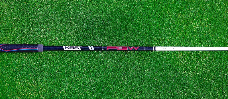 KBS PGW Players Graphite Wood Shaft on green turf, showcasing high-performance design for various swing speeds.
