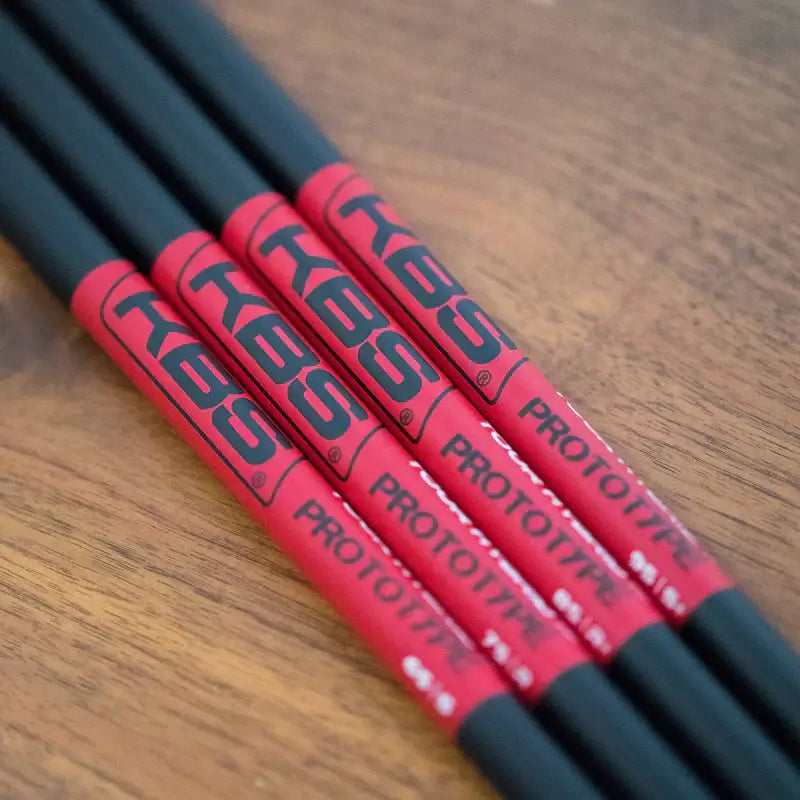 KBS Tour Graphite Hybrid Prototype Shafts showcasing performance and stability with a striking red and black design.