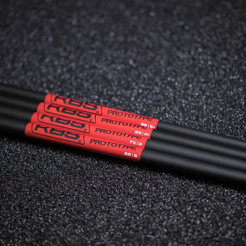 KBS Tour Graphite Hybrid Prototype Shafts in black with red graphics, showcasing performance and stability for golfers.