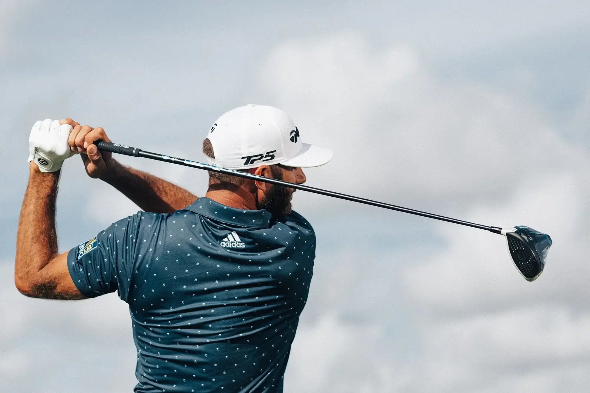 Golfer swinging a driver with LA Golf DJ Series Wood Shaft on the course, showcasing distance and accuracy.