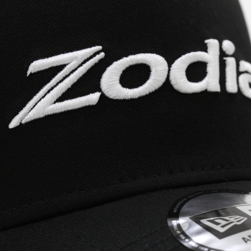 Zodia Metal Badge Cap featuring embroidered logo on a black cotton base, showcasing stylish design details.