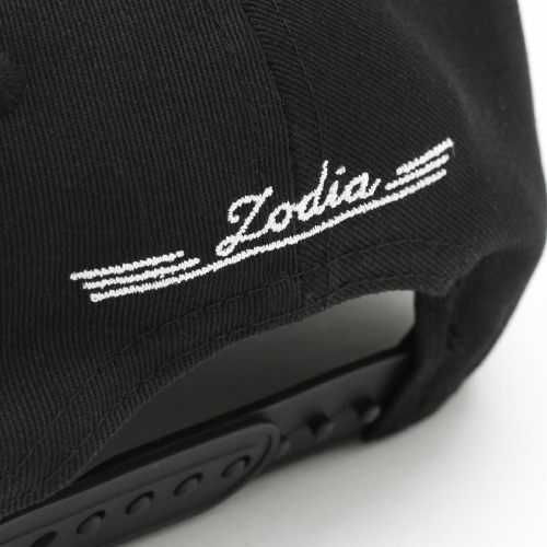 Black cap detail showing 'Zodia' embroidered logo on the back, emphasizing stylish design and adjustable fit.