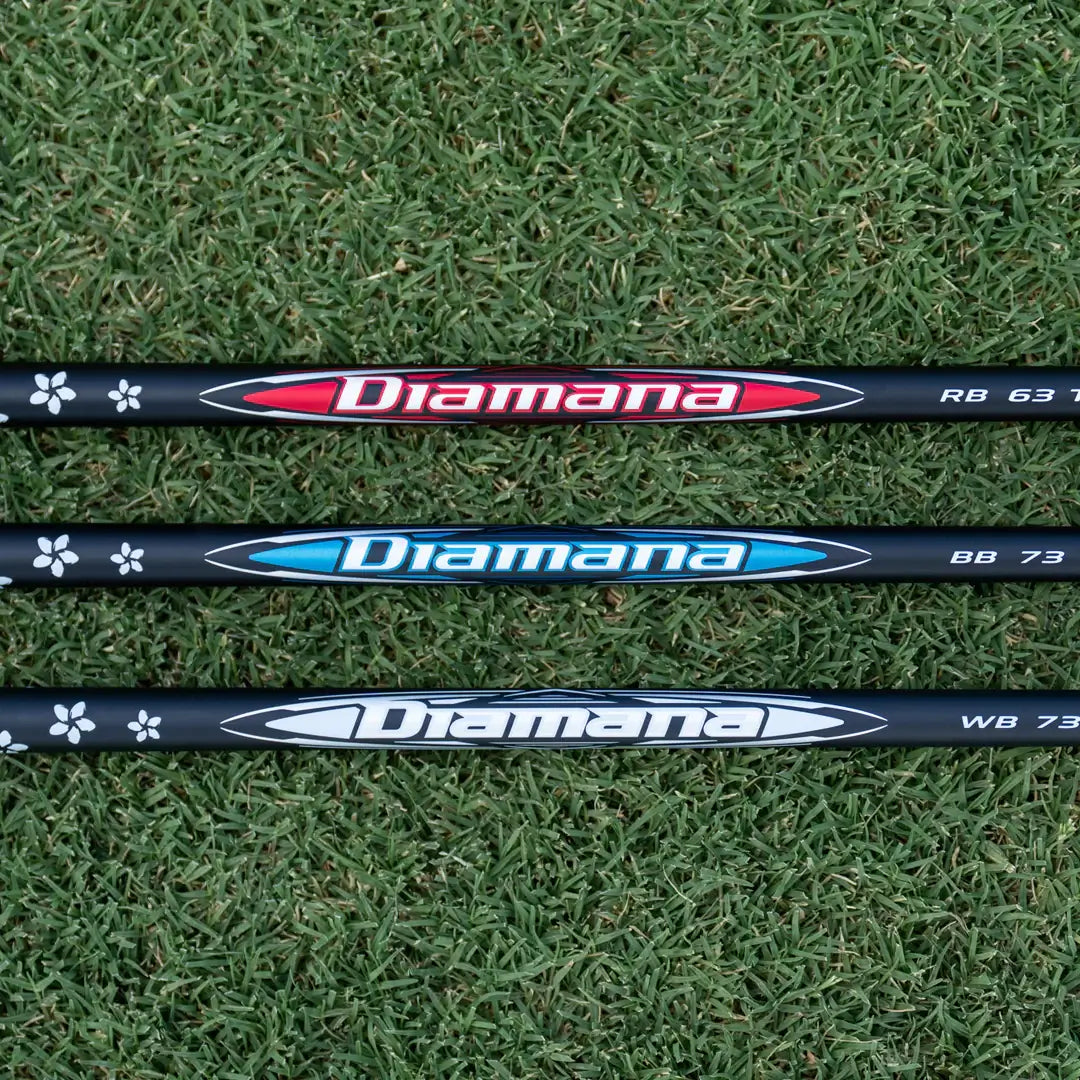 Three Mitsubishi Diamana shafts (RB, BB, WB) displayed on grass, showcasing custom options for golfers.