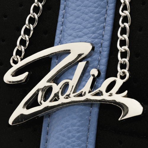 Zodia logo on neoprene tote bag with chain detail and blue leather accents.