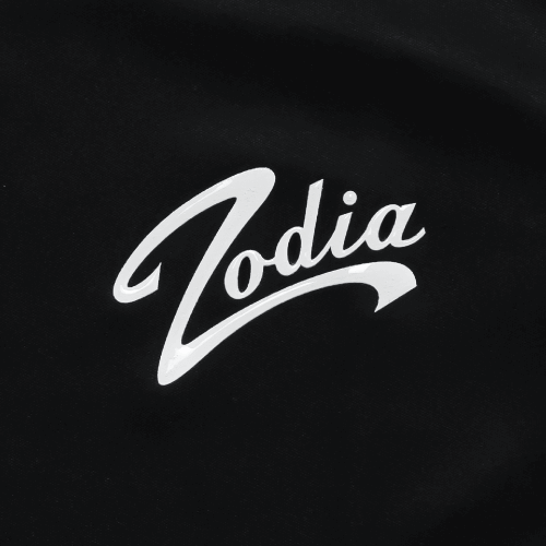 Zodia logo in white on a black background, featured on a stylish polo shirt.