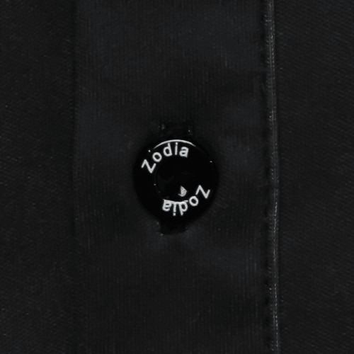 Close-up of the Zodia Splash Polo Shirt button showcasing the logo design.