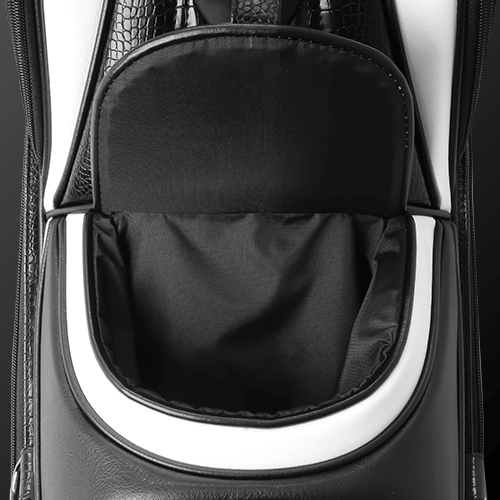 Close-up of the magnetic pocket on Zodia Standard Caddie Bag, showcasing its sleek black and white design.