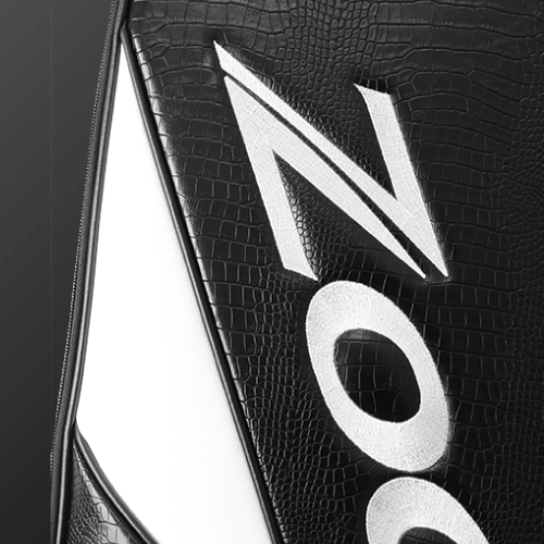 Close-up of Zodia Standard Caddie Bag showing black caiman pattern and logo detail in white.