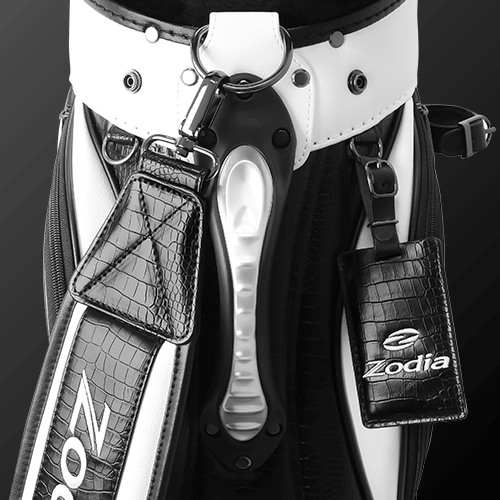 Close-up of Zodia Standard Caddie Bag with caiman pattern, black and white design, featuring storage pockets and logo.