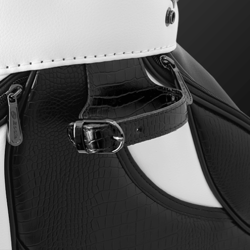 Close-up of Zodia Standard Caddie Bag showing caiman pattern and magnetic pocket detail in black and white.