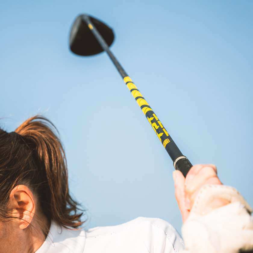 TPT Nitro Range Driver Shaft in action, showcasing its yellow and black design for optimal distance and precision.