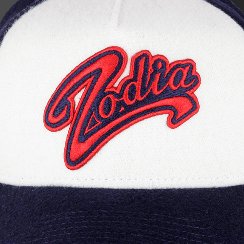 Zodia × NEW ERA wool cap featuring embroidered logo on a gray and navy A-Frame Trucker style, perfect for autumn and winter.