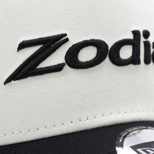 Close-up of Zodia 2tone Mesh Cap showcasing cream front panel and embroidered logo detail.