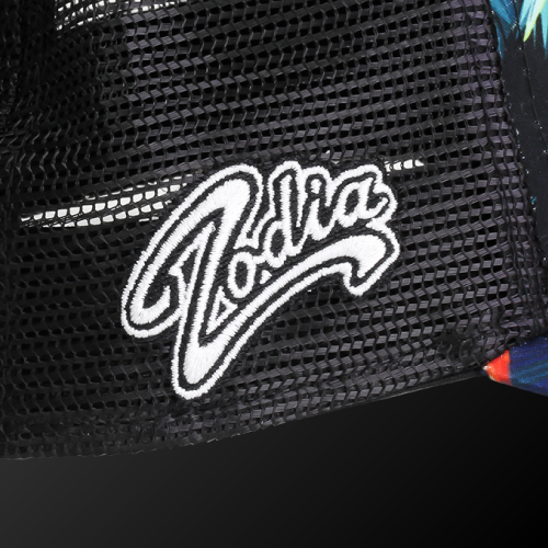 Close-up of Zodia logo on a black mesh cap with botanical pattern, highlighting summer resort style.