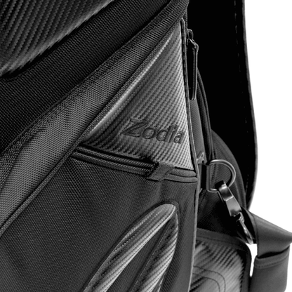 Close-up of Zodia Carbon Design Caddy Bag II showcasing durable carbon-look fabric and zippered pockets.