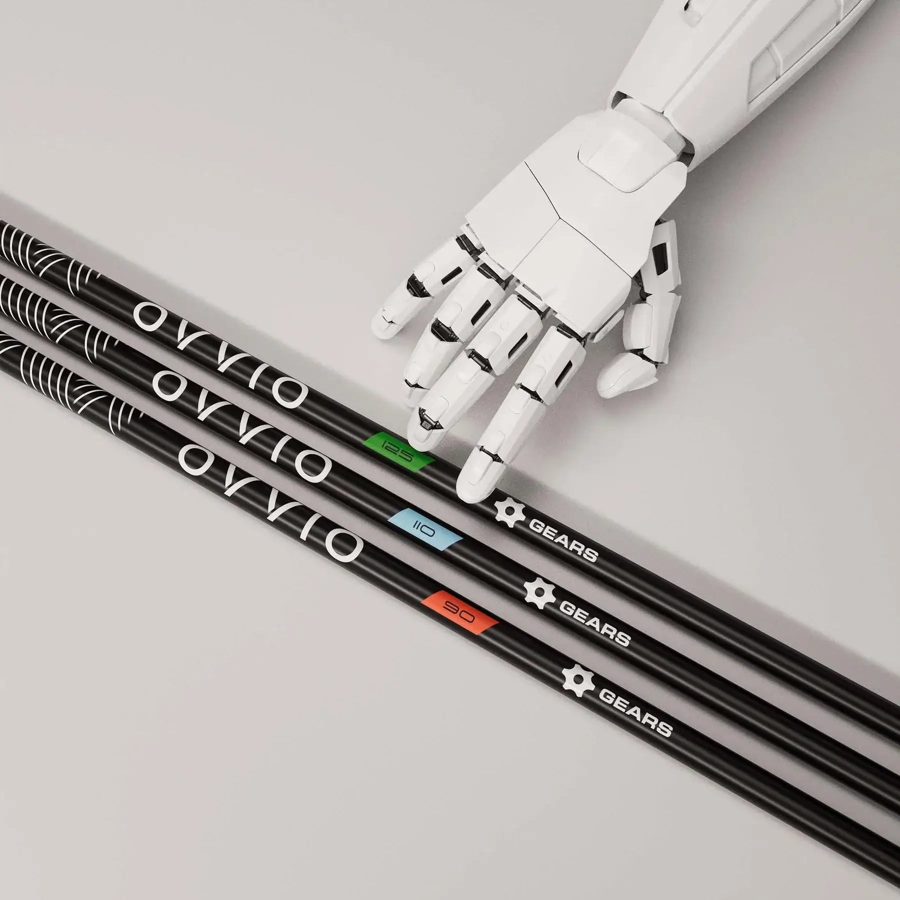 OVVIO Iron Shafts by GEARS Golf, displayed with a robotic hand, showcasing advanced graphite technology.