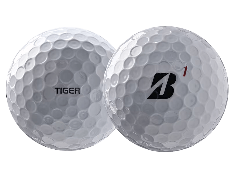 Bridgestone 2026 TOUR B X Tiger Woods Edition Golf Balls (12 Pack) showcasing the unique designs on each golf ball.