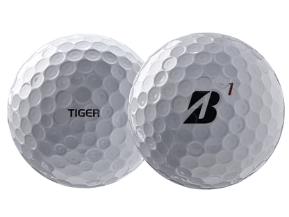 Bridgestone 2026 TOUR B X Tiger Woods Edition Golf Balls (12 Pack) showcasing the unique designs on each golf ball.