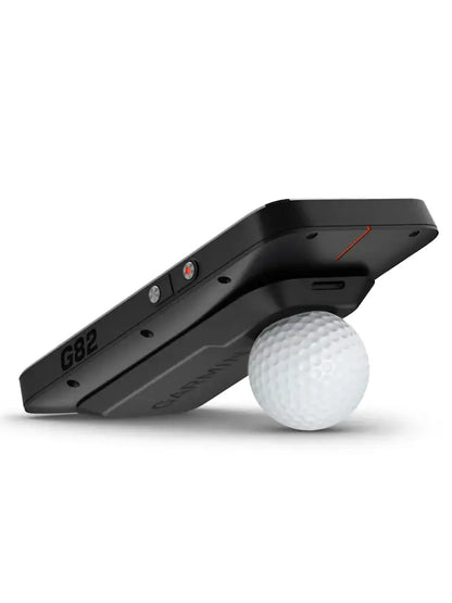Garmin Approach® G82 GPS & Launch Monitor with a golf ball ready for use on the course.
