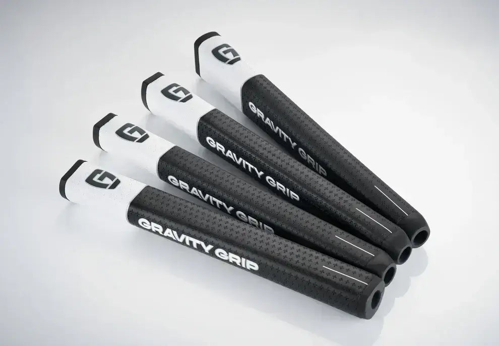 GG1 Gravity Grip golf grips in black and white, designed for improved accuracy and reduced face rotation.