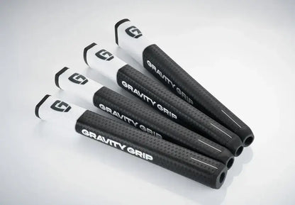 GG1 Gravity Grip golf grips in black and white, designed for improved accuracy and reduced face rotation.