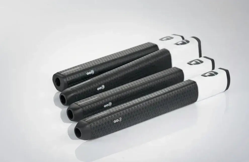 Image of GG1 Gravity Grip putter grips in black and white, showcasing their design and material features.