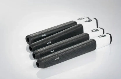Image of GG1 Gravity Grip putter grips in black and white, showcasing their design and material features.