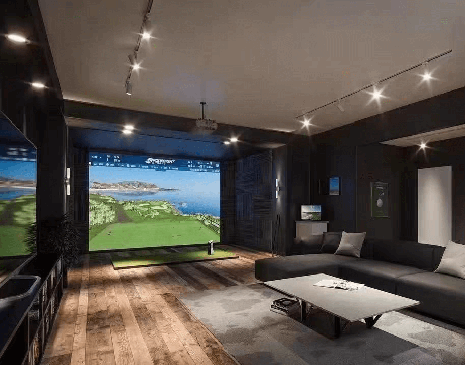 Golf Simulator Championship Package in a modern home entertainment setup with large screen and cozy seating.