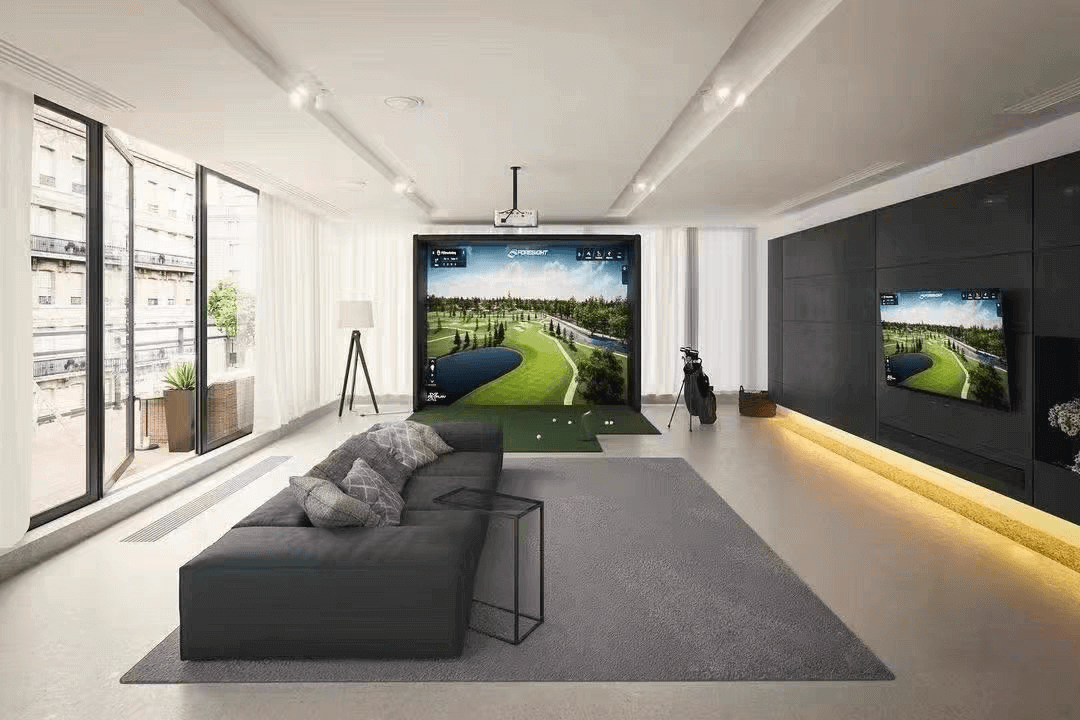 Golf Simulator Value Package setup in a modern living room, featuring a large screen and realistic visuals.