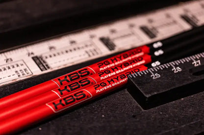 KBS PGH Players Graphite Hybrid Shafts displayed with a ruler for precise measurement and comparison.