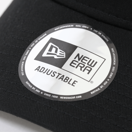 Close-up of New Era adjustable cap label showcasing logo and branding details.