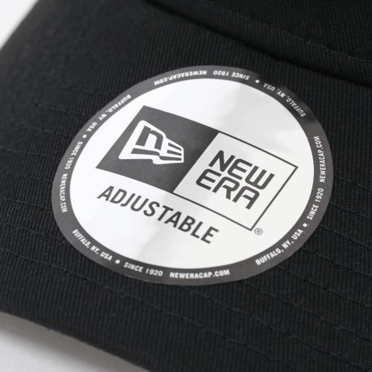 Close-up of New Era adjustable cap label showcasing logo and branding details.
