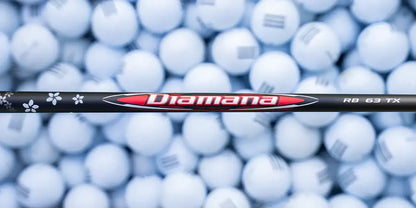 Mitsubishi Diamana RB Redboard wood shaft against a backdrop of white golf balls, designed for performance and customization.