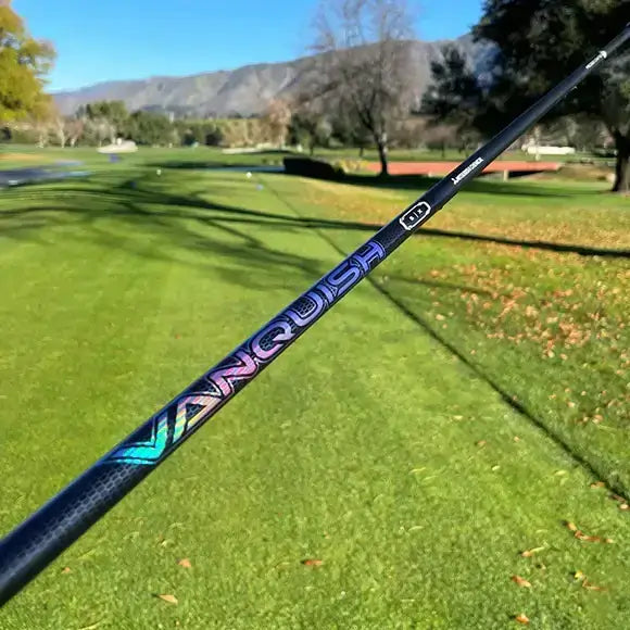 Mitsubishi VANQUISH driver shaft showcasing premium design on a golf course background.