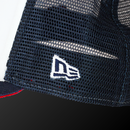 Close-up of the Zodia x NEW ERA 9FORTY cap featuring the embroidered New Era logo on a navy mesh panel.
