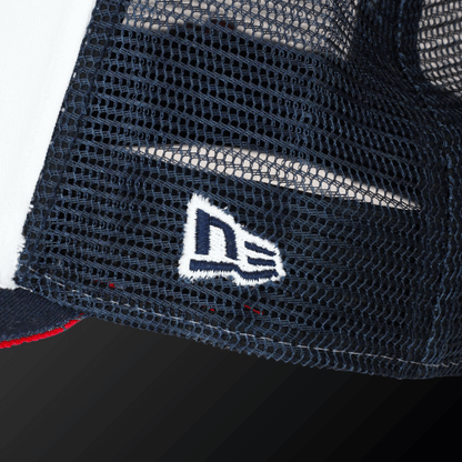 Close-up of the Zodia x NEW ERA 9FORTY cap featuring the embroidered New Era logo on a navy mesh panel.