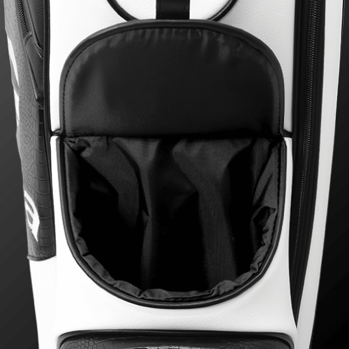 Close-up of Zodia Standard Caddie Bag's magnetic pocket, showcasing its chic black and white design.