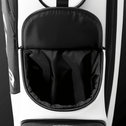 Close-up of Zodia Standard Caddie Bag's magnetic pocket, showcasing its chic black and white design.