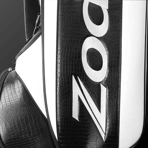 Close-up of Zodia Standard Caddie Bag featuring chic black and white caiman pattern and logo detail.