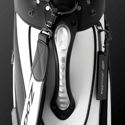Close-up of Zodia Standard Caddie Bag handle showcasing chic black and white design and ergonomic grip for easy carrying.