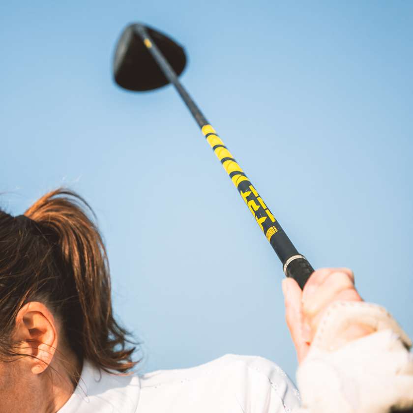 TPT Nitro Range Driver Shaft in action, showcasing its yellow and black design for optimal distance and precision.