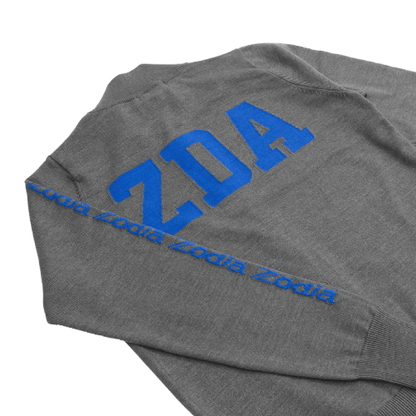 Zodia Zip-Up Sweater showing grey fabric with blue logo on back and sleeve, emphasizing stylish design and functionality.