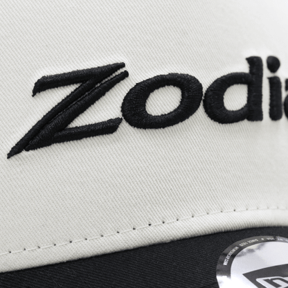 Close-up of Zodia 2tone Mesh Cap showcasing cream front panel and embroidered logo detail.