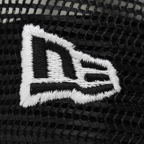 Close-up of the New Era logo embroidered on a black mesh cap.